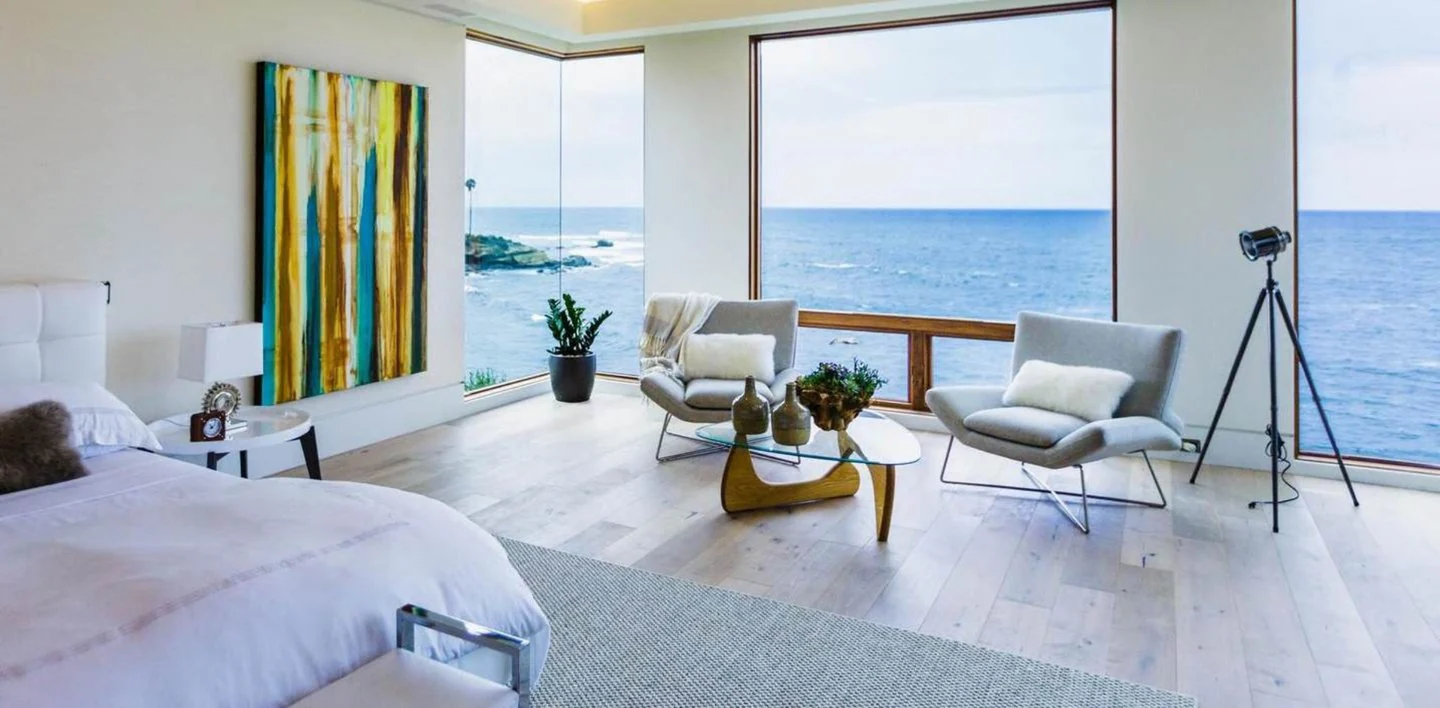 Custom Icon Collection painting by Erik Skoldberg above the bed in a private La Jolla home, facing an ocean window